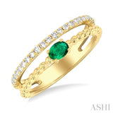1/5 ctw Round Cut Diamond and 4X3MM Oval Shape Emerald Precious Split Twin Ring in 10K Yellow Gold