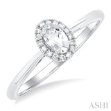 5x3 MM Oval Shape White Topaz and 1/20 Ctw Single Cut Diamond Halo Semi-Precious Ring in 14K White Gold