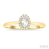 5x3 MM Oval Shape White Topaz and 1/20 Ctw Single Cut Diamond Halo Semi-Precious Ring in 10K Yellow Gold