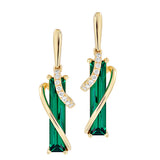 14K yellow gold earrings featuring 14x3mm baguette Chatham lab grown emeralds and Chatham lab grown diamond accents