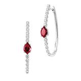 14K white gold hoop earrings featuring 8x5mm flame-cut Chatham lab grown rubies with Chatham lab grown diamond accents.