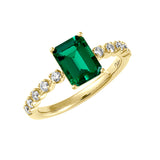 This 14K yellow gold ring features an 8x6mm emerald-cut Chatham lab grown emerald with Chatham lab grown diamond accents along the shank.